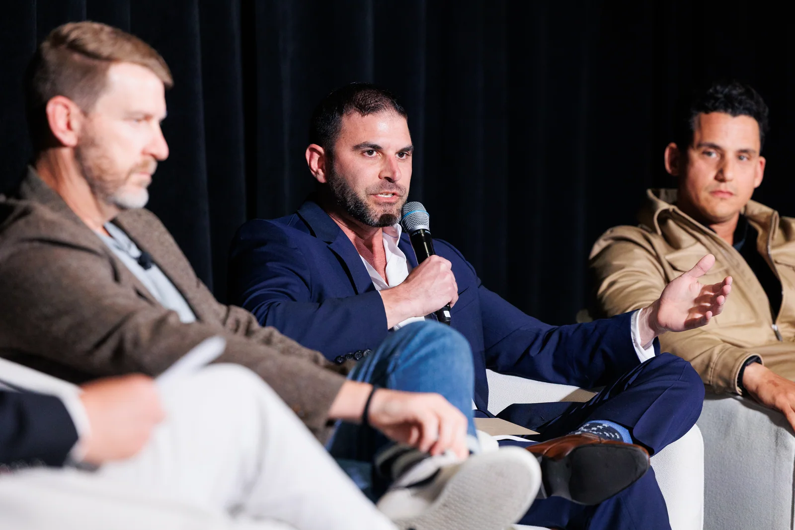 Alex Zemianek speaking on a panel about AI, security, and vacation-rental intelligence at the 2026 VRMA Executive Summit